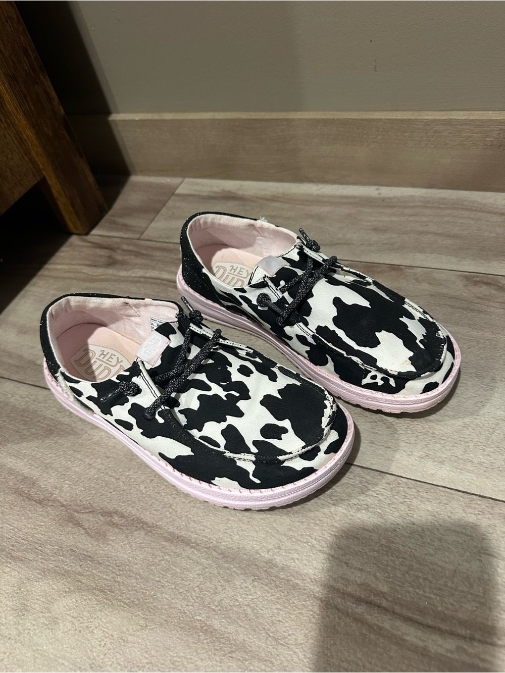 Hey Dudes Girls' Black & White Cow Print Pink-Trim Slip-On Shoes